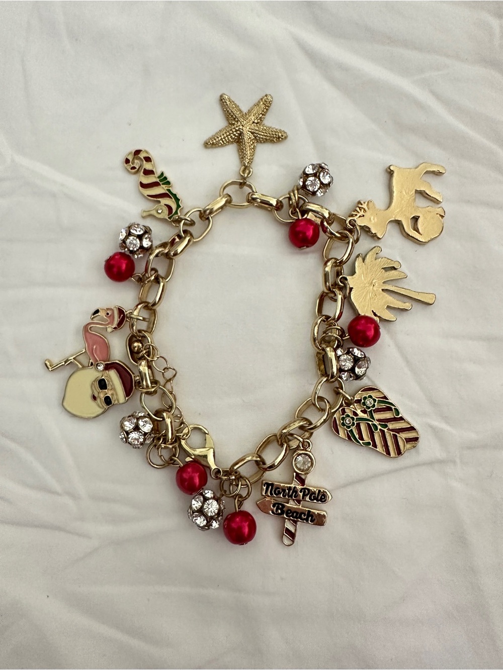 Gold-Tone North Pole Beach Charm Bracelet with Red Accents $14